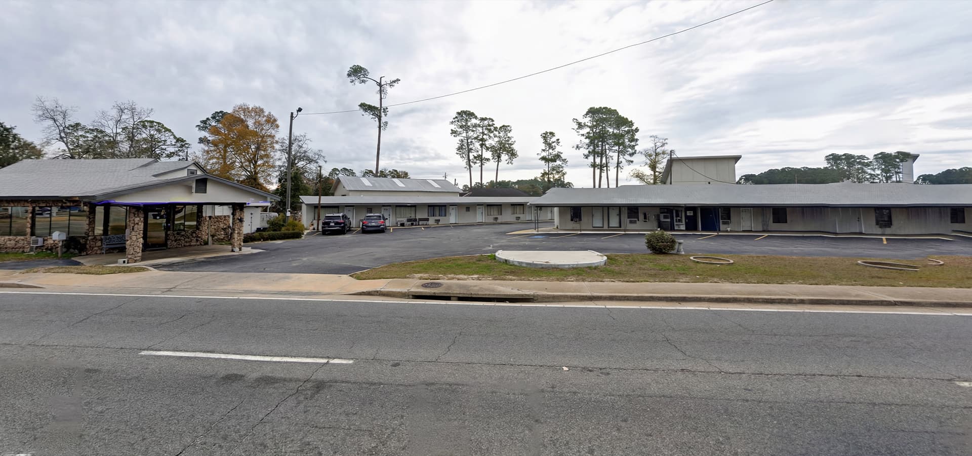 Comfortable room at Pine Lodge Motel with cozy bed and modern amenities